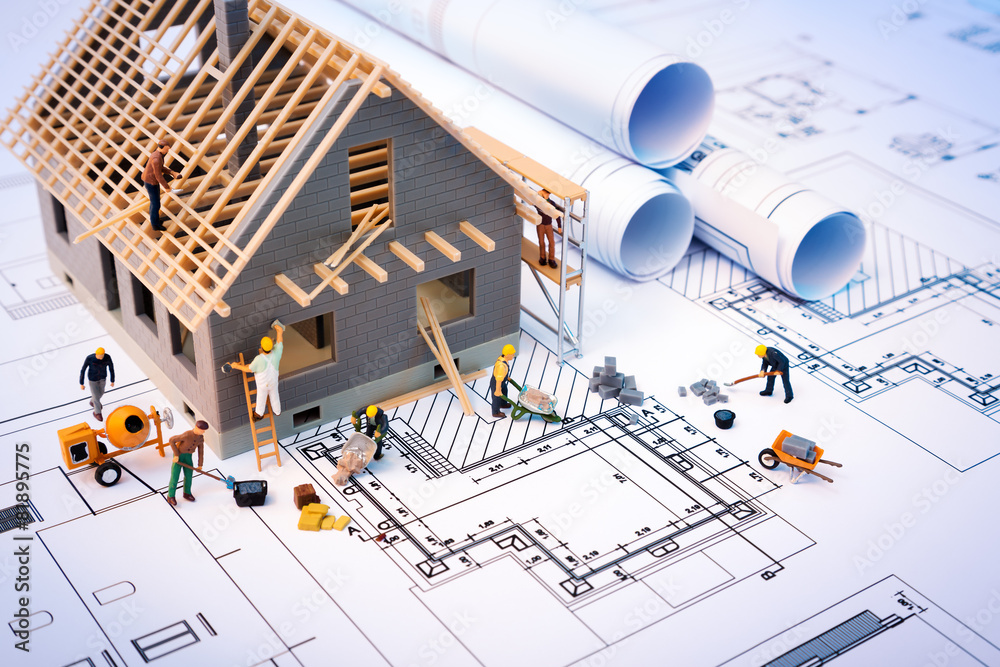 Illustrative house construction model on architectural plans